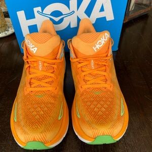HOKA Clifton running shoe.  Orange